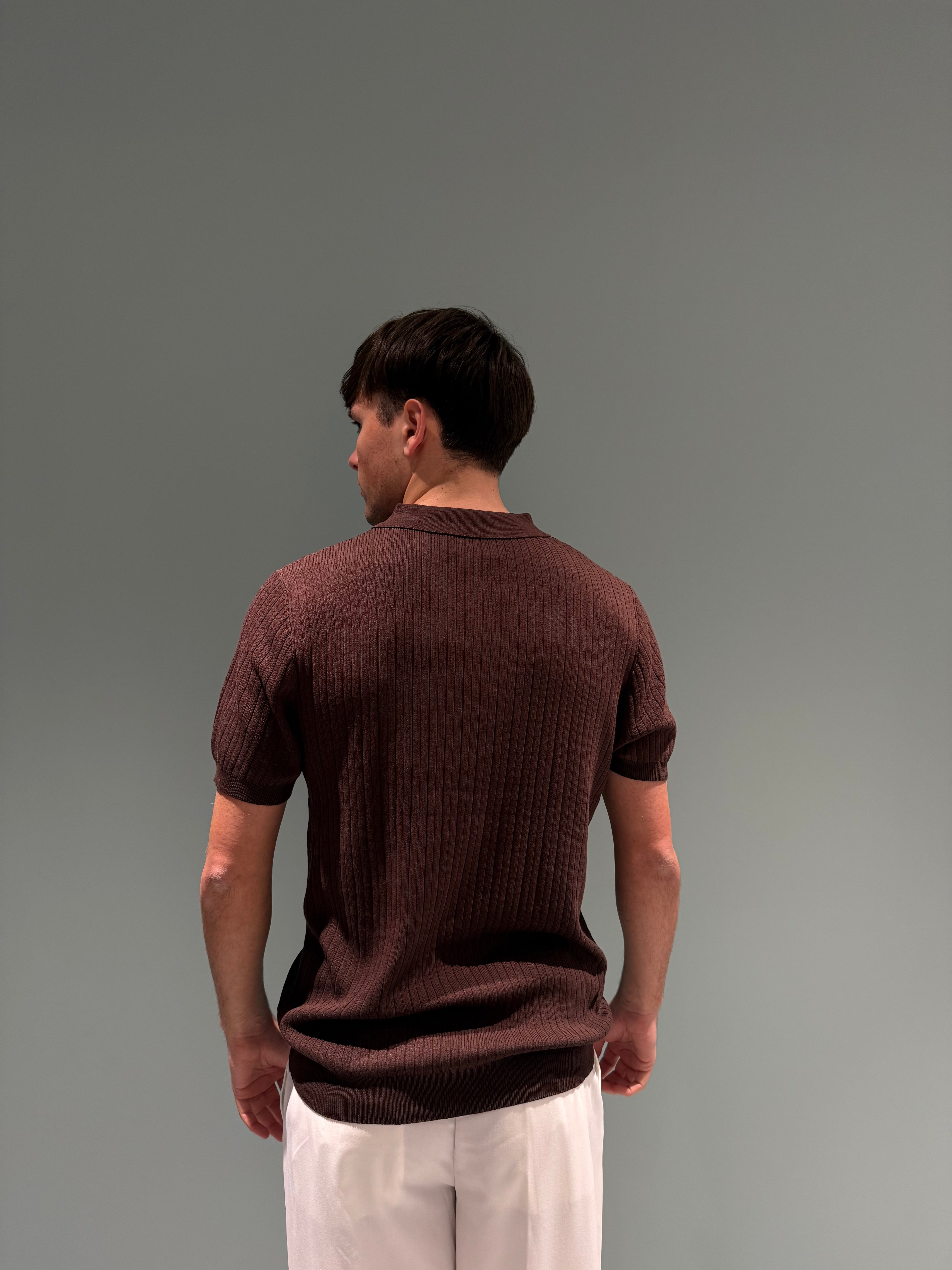 polo lavorata con bottoni