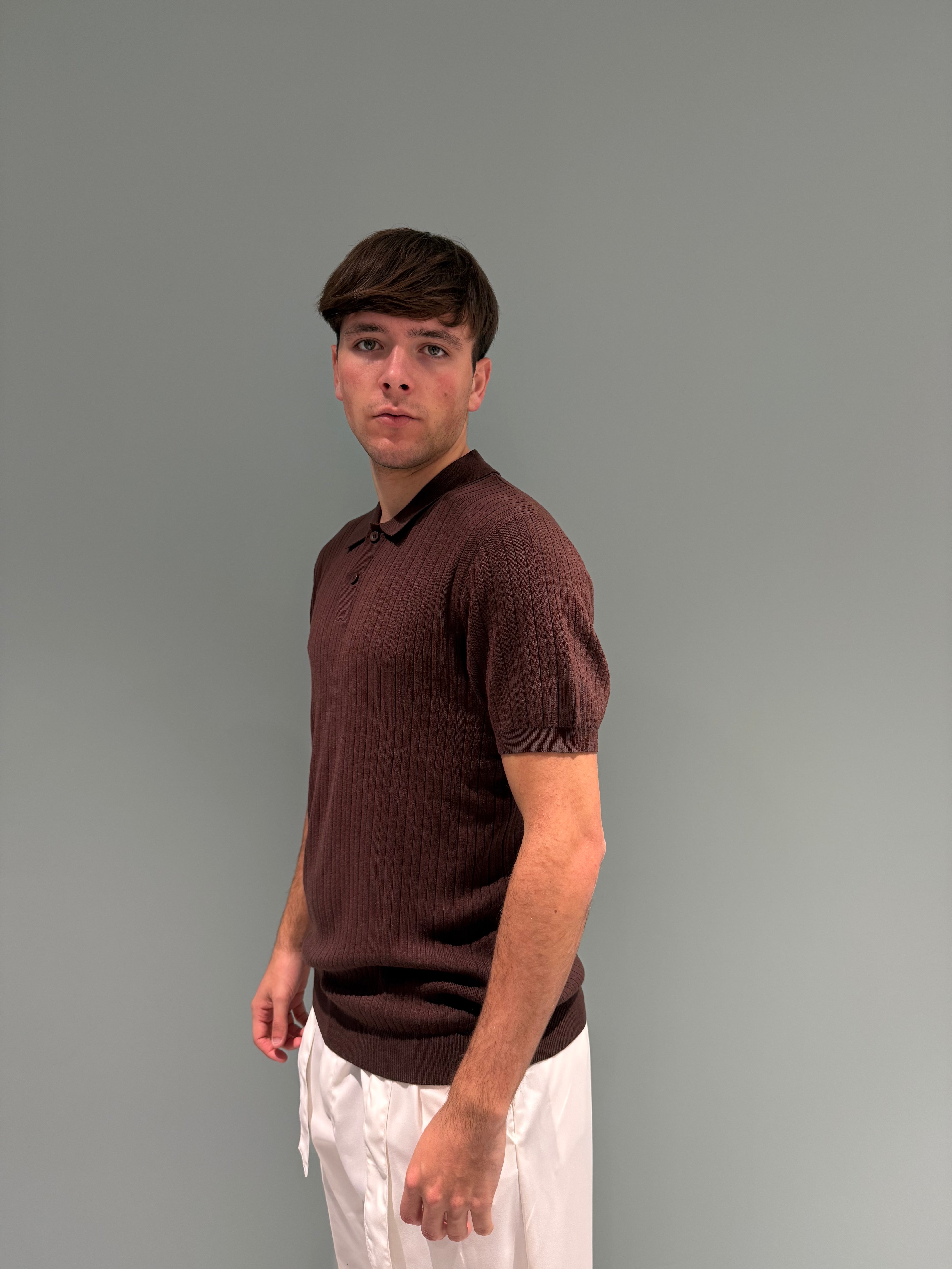 polo lavorata con bottoni